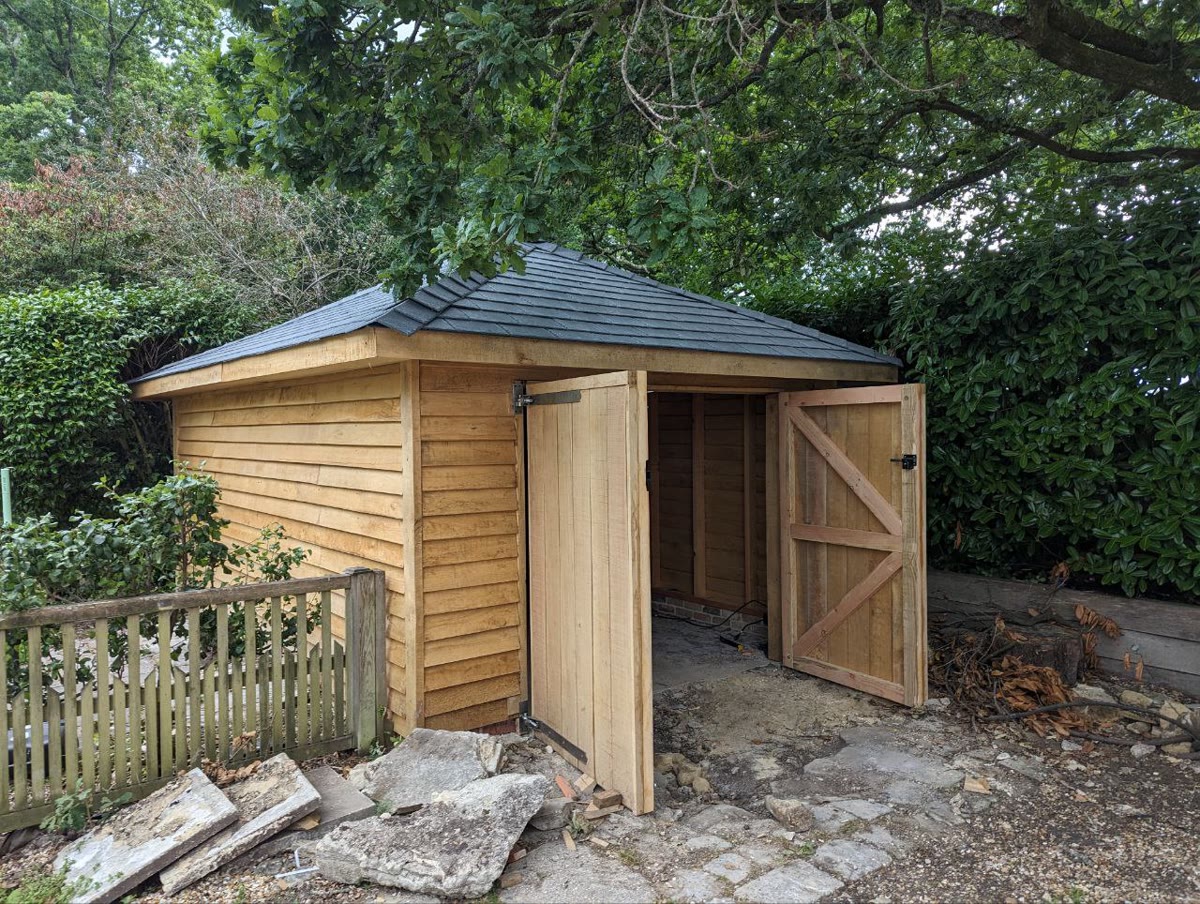 Hipped roof workshop with doors open showing interior